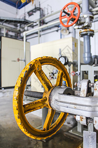 黄色阀门车轮制造业金属场地管道压力工业技术背景图片