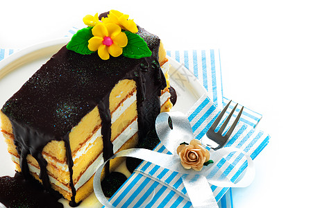 巧克力和鲜花蛋糕海绵香草盘子餐巾蓝色小吃食物糕点面包可可图片