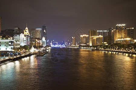 中国广州的朱江河和现代建筑 夜里建筑学反射日落城市旅行景观游客旅游公园港口图片