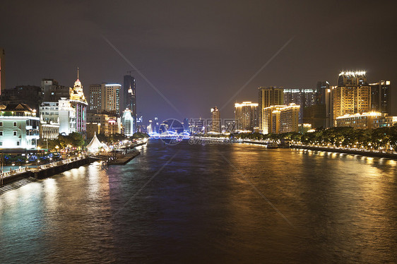 中国广州的朱江河和现代建筑 夜里建筑学反射日落城市旅行景观游客旅游公园港口图片