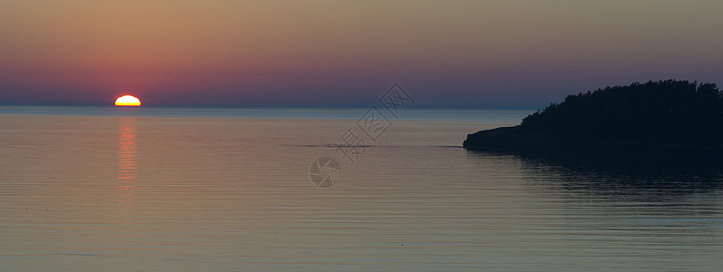 岛屿日落橙子天空地平线海岸风景太阳海洋图片