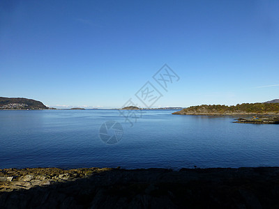 Fjord和岛屿岩石山脉蓝色胰岛巨石天空灯塔图片