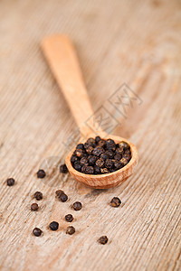 木勺中黑胡椒宏观食物棕色烹饪粮食勺子美食调味品木头种子图片