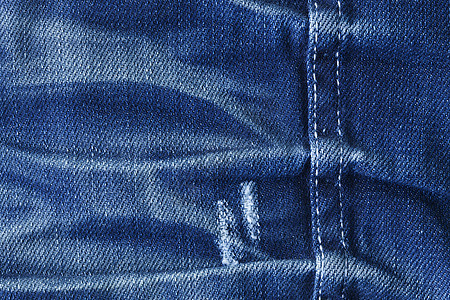 蓝色牛仔裤的前线细节织物衣服纺织品裤子棉布宏观材料牛仔布服装图片