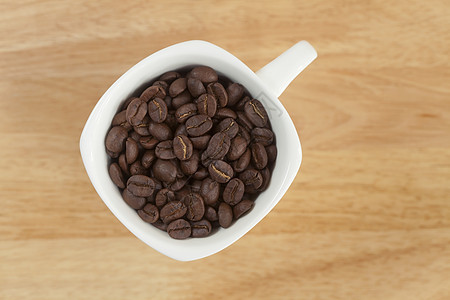 木本底咖啡杯中的咖啡豆咖啡店木头饮料黑色工作室香气生活研磨咖啡芳香图片