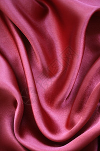 粉色优雅丝绸作为背景装饰折痕涟漪织物曲线布料纺织品艺术紫丁香材料图片