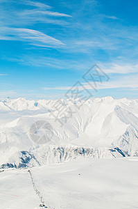 明亮的冬天天雪山场景滑雪全景假期岩石太阳白色蓝色天空冰川图片