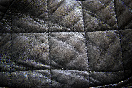 皮革纹理与线性衬垫结合 皮革的一部分机器色调宏观皮肤补丁崎岖棕褐色材料缝纫织物图片