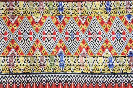手工编织的泰文风格织布贴近纹理衣服染料墙纸棉布色调丝绸织物传统纺织品民间图片