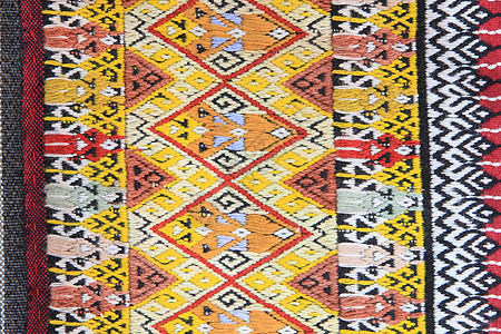 手工编织的泰文风格织布贴近纹理染料纺织品衣服民间传统丝绸棉布墙纸色调织物图片