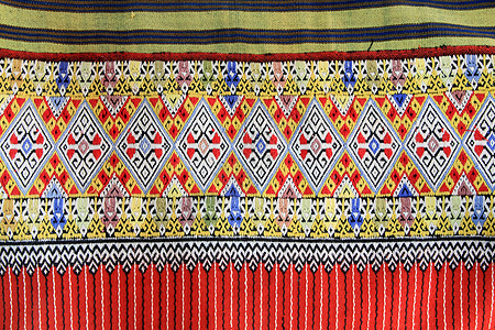 手工编织的泰文风格织布贴近纹理墙纸织物棉布染料纺织品民间色调衣服丝绸传统图片