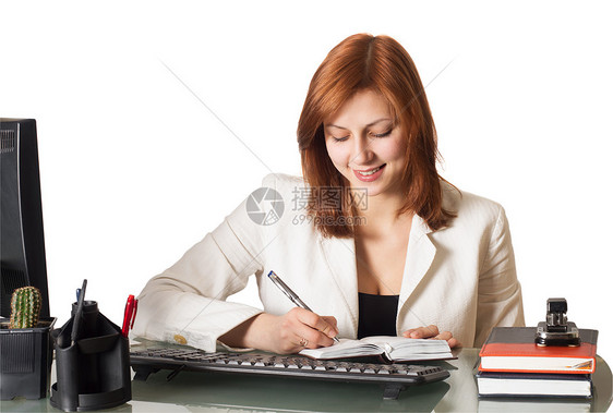 女孩写在笔记本上展示秘书写作教育头发商务桌子人士商业订书机图片