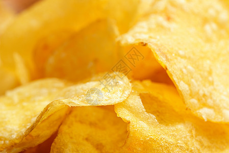 Crisps 特写食物小吃垃圾油炸土豆营养盐渍芯片脂肪午餐图片