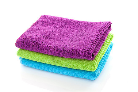 彩色的毛巾蓝色棉布淋浴浴室绿色纺织品紫色背景图片