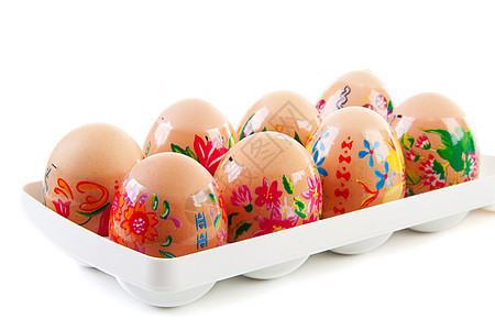 由儿童为东边儿童装饰鸡蛋的鸡蛋棕色花朵食物持有者白色背景图片