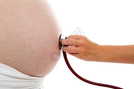 怀孕肚子上带听诊器的儿童手生活父母孩子母性投标婴儿分娩母亲腹部图片