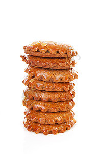 典型荷兰填充的姜饼饼干皮箱糖果食物窥镜圆形蛋糕糕点图片