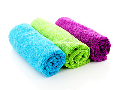 三个彩色的滚动毛巾背景图片