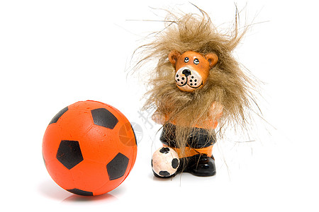 橙色足球球和狮子运动雕像锦标赛橙子圆形游戏竞赛图片