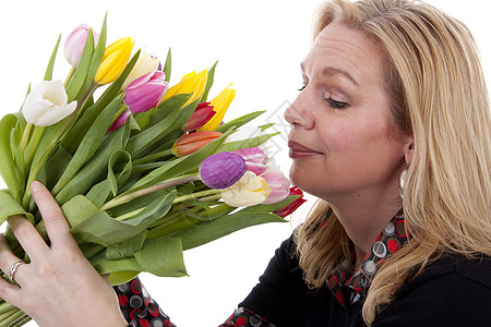拥有荷兰郁金花的妇女花朵生日郁金香妈妈们背景图片
