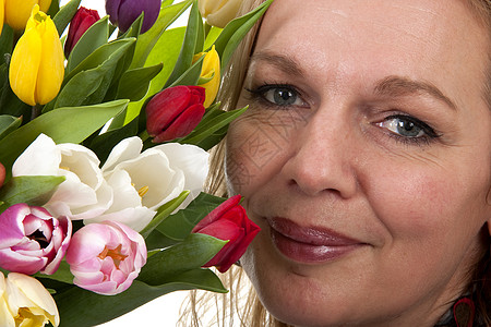 拥有荷兰郁金花的妇女生日妈妈们郁金香花朵背景图片