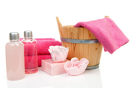 Sauna或SPA的粉色浴浴配件毛巾桑拿补水温泉花朵浴室按摩瓶子洗发水配饰图片