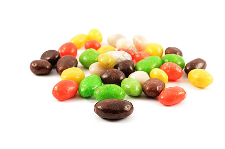 拖拉器绿色甜点花斑棕色黄色巧克力小吃红色白色糖果背景图片