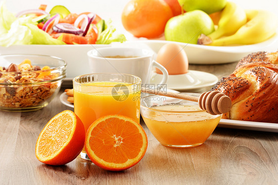 早餐 包括咖啡 面包 蜂蜜 橙汁 梅斯利a桌子橙子玻璃水果粮食健康盘子种子厨房果汁图片