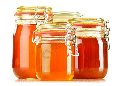 含有在白色上分离的蜂蜜罐头成分香料营养药物早餐饮食食物甜点蜜蜂消费者杂货店图片