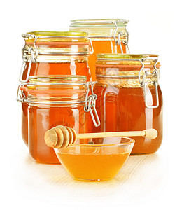 含有在白色上分离的蜂蜜罐头成分香料治愈营养素烹饪花蜜产品早餐甜点玻璃消费者图片