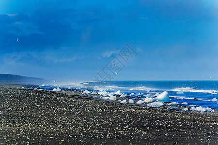 冰山被波浪打碎冰川海滩水晶蓝色休息冷藏冻结山脉寒冷天空图片