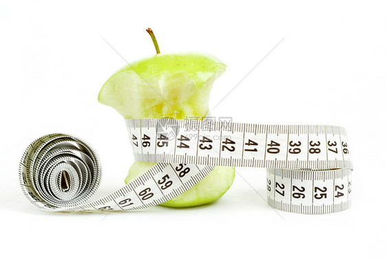 用测量磁带在白色上隔离的绿色比特点苹果阴影美食水果废料宏观果汁小吃花园厘米食物图片