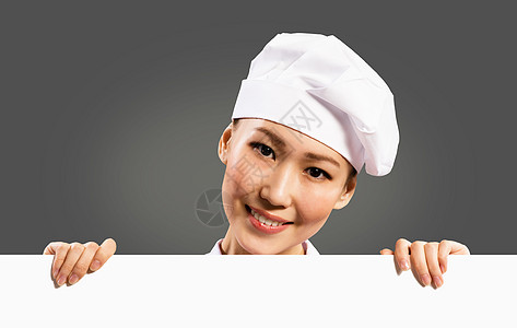 持有文本海报的女厨师职业食物工作室广告牌菜单女性女孩厨房木板美食图片