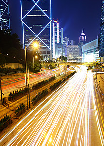 夜间现代城市速度驾驶街道旅行蓝色线条公共汽车运动商业建筑图片