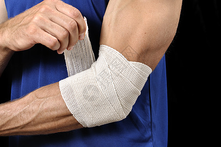 下皮伤害蓝衬衫运动员网球肘白色黑色疼痛手臂绷带男性背景图片