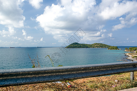 在泰国海滩的沙滩上热带场景晴天天空地平线海浪石头日落太阳蓝色图片