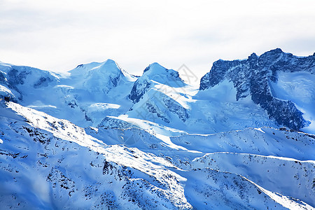 瑞士冬季的雪冬风景 冬季假期蓝色首脑冰川地形地标旅行天空阳光顶峰图片