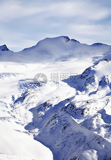 冬季雪雪景观地标岩石冰川高度蓝色阳光晴天顶峰地形首脑图片