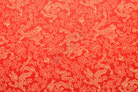 红中国丝绸碎片 金龙和鲜花风格织物材料文化纺织品红色装饰品装饰背景图片