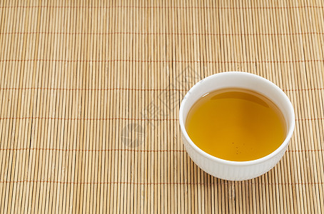 绿茶杯杯子竹子餐垫白色绿茶背景图片