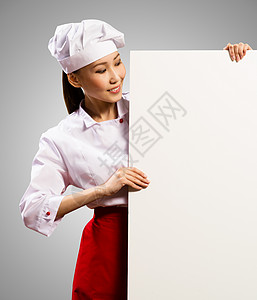 持有文本海报的女厨师木板女性横幅女孩职业菜单面包师工作室帽子烹饪图片