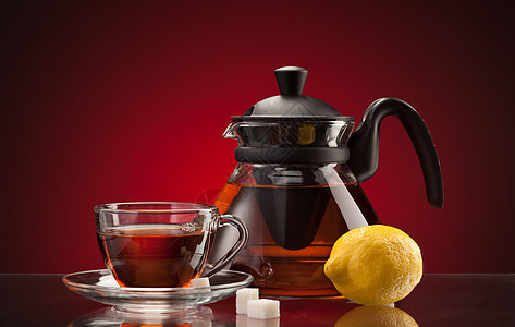 茶杯和茶壶杯子仪式黑色柠檬草本玻璃桌子棕色盘子红色图片