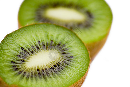 Kiwi 切片热带白色种子小吃饮食食物绿色异国维生素营养图片