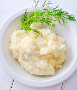 白碗里的土豆泥薄荷土豆木头草药黄油盘子午餐营养饮食蔬菜图片