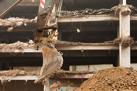 销毁装有设备的混凝土建筑垃圾城市住宅工作机械碎片损害拆除地震瓦砾图片