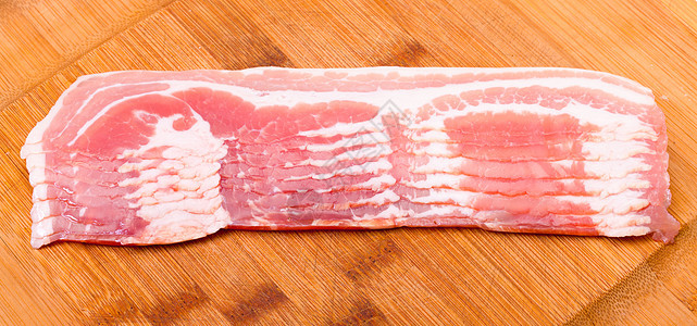 新鲜切菜培根木板烹饪小吃猪肉火腿美食粉色熏制产品白色图片