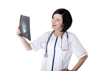 女医生或护士在看放射摄影照片疾病射线儿科放射科检查考试电影女性保健工作图片