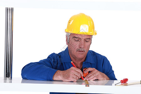 商务人士使用测量磁带就业商务建设者安全工人工具螺丝刀蓝色建造适应症图片