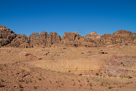 约旦佩特拉的景观石头沙漠装备雕刻文化旅行砂岩历史性建筑学雕塑图片