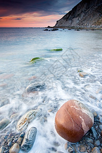 西班牙巴斯克州比兹卡亚巴里卡海滩岩石日落地区布里科蓝色天空石头海滩海洋图片